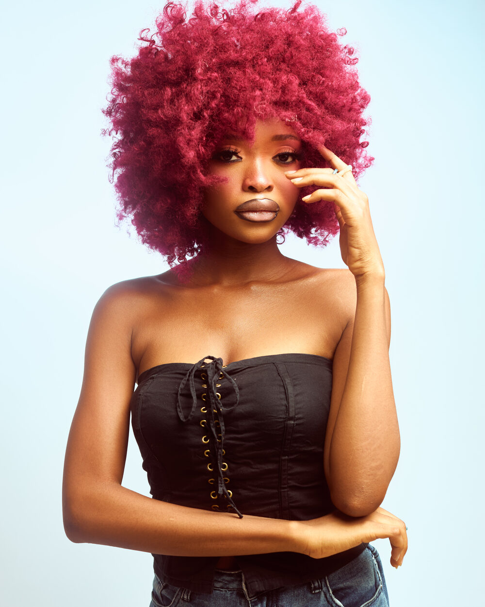 Editorial studio portrait, red afro